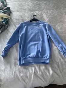 Purple Nike jumper.