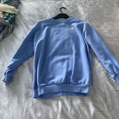 Purple Nike jumper.