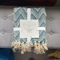 Blue and white throw for collection from Greystones