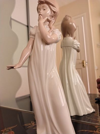 Nao by Lladro.  Yawning Girl. Damaged.