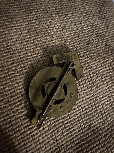 WW2 German documents with an eagle pin and an identification tag for one soldier