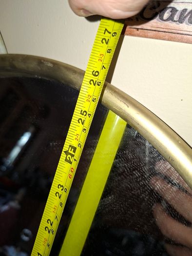 Beautiful Late 20th century Arched Brass Colored Metal Wall Mirror, the arched plate within tubular uprights with spherical finials. Collection is Preferred