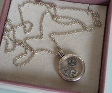 Pandora floating locket necklace with three petite charms very good condition fully hallmarked