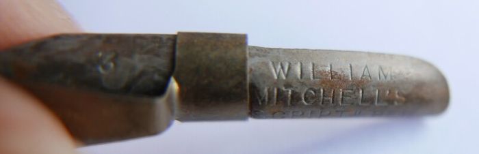 Vintage dip pen with collection of assorted nibs
