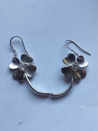 A pair of Sterling Silver earrings.