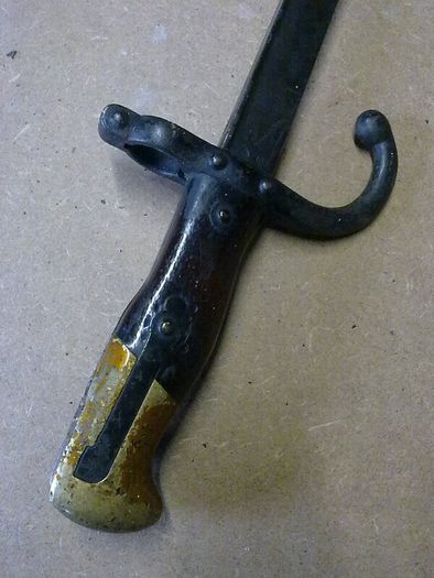 19th century French bayonet with brass and wooden handle.