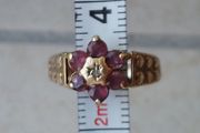 Garnet 9K gold ring with central diamond