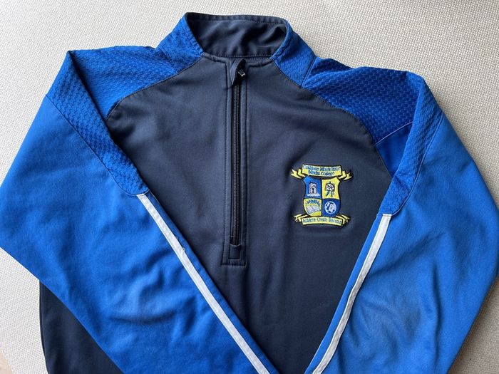 Merlin College zip top, size S