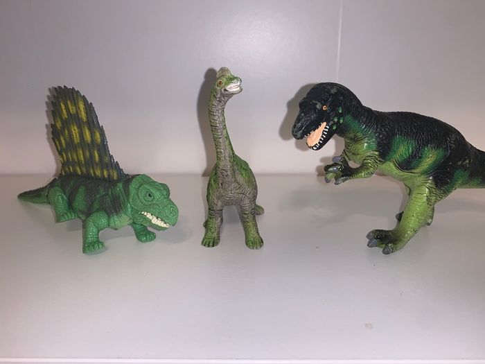 Three dinosaur toys