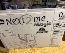 Brand new chicco Next2me Magic in Grey with light projector included