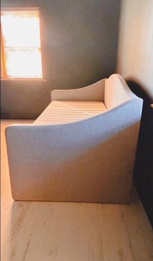Light grey  upholstered daybed with under-bed storage drawer