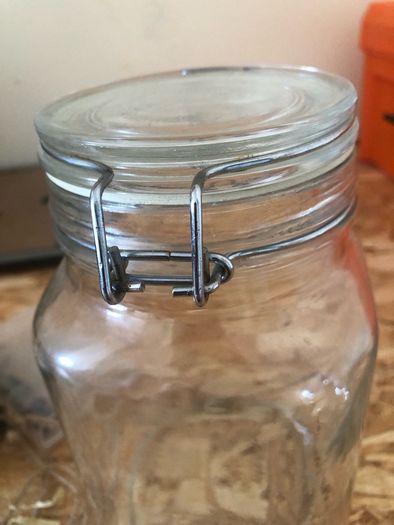 Airtight glass storage jar with clasp