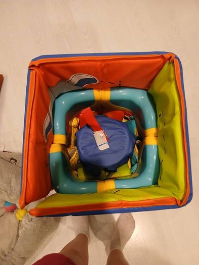 Bright and colorful square baby playpen featuring a cheerful animal safari theme.