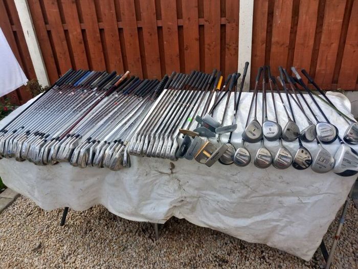 A selection of Golf clubs. Bags and golf balls.