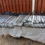 A selection of Golf clubs. Bags and golf balls. Image 9