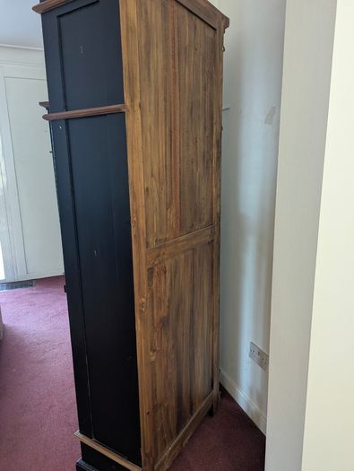 Tall black and wood colour bookcase