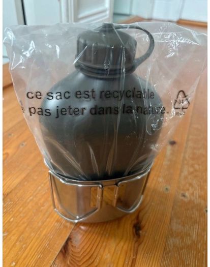 Genuine army-style metal water bottle with matching nesting cup. Military surplus