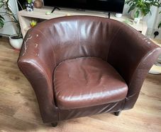 Brown faux leather tub chair