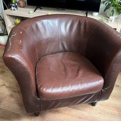 Brown faux leather tub chair