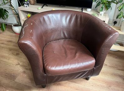 Brown faux leather tub chair