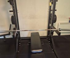 COMPLETE gym setup squat rack + barbell + over 200kg worth of plates and adjustable bench