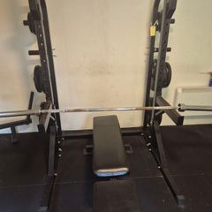 COMPLETE gym setup squat rack + barbell + over 200kg worth of plates and adjustable bench
