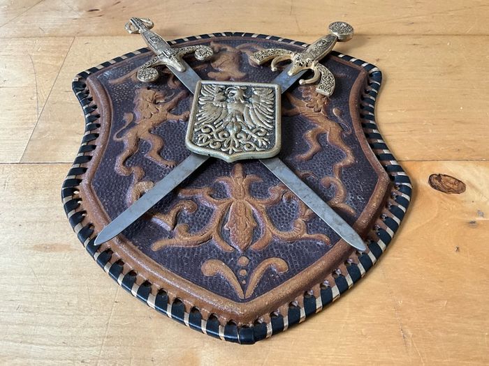 Vintage Spanish-made wall plaque featuring a decorative coat of arms.