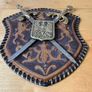 Vintage Spanish-made wall plaque featuring a decorative coat of arms. Image 2