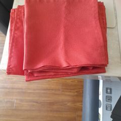 Six rust coloured napkins