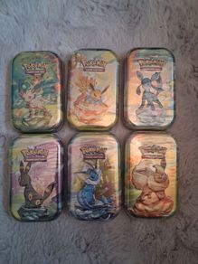 Prismatic Evolution Tins