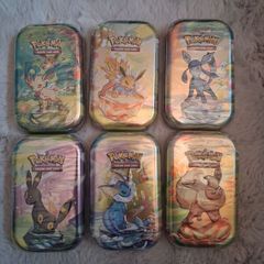 Prismatic Evolution Tins