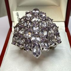 Silver ring with amethysts.