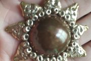 Vintage pendant on a long chain.