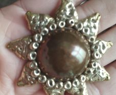 Vintage pendant on a long chain.
