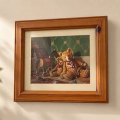 Vintage style framed teddy bear print in a warm wooden frame