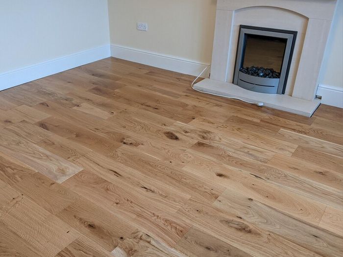 Laminated wood floor fitting