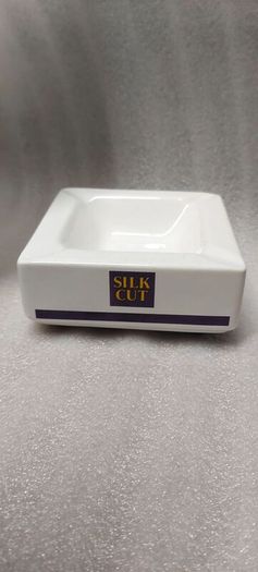 Silk Cut square ashtray ,collectors item, with smoking bans advertising bans on ashtrays for health reasons, price includes post to anywhere in Ireland thank you,,see pictures for condition ,take as is,litte pitting on glaze ,sold as is.