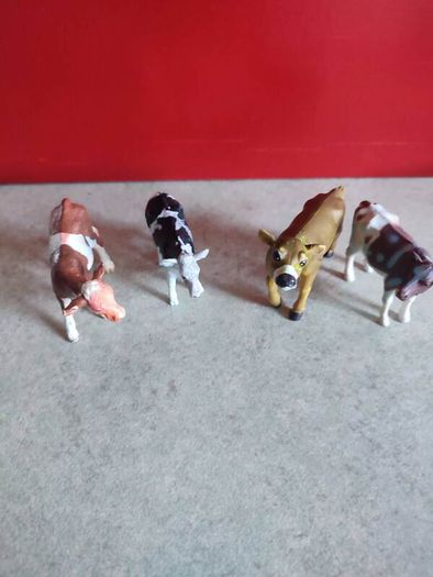Collection of 4 COWS animal Farm toys .