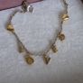 Pandora chain bracelet with gold yellow plated hearts, and dangle letters spelling LOVE adjustable closure with three length options: 16 cm, 18 cm, and 20 cm. In good condition few signs of wear. Image 3