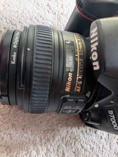 Nikon D7000 DSLR + Nikon 50mm f/1.8G + Tamron 18-200mm + Tripod + Camera Bag