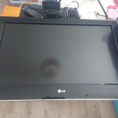 32 inch LG TV with remote and stand in box