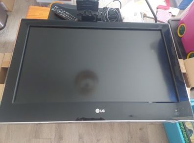 32 inch LG TV with remote and stand in box