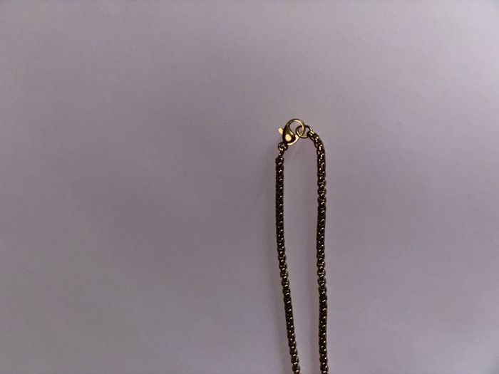 Gold cross.