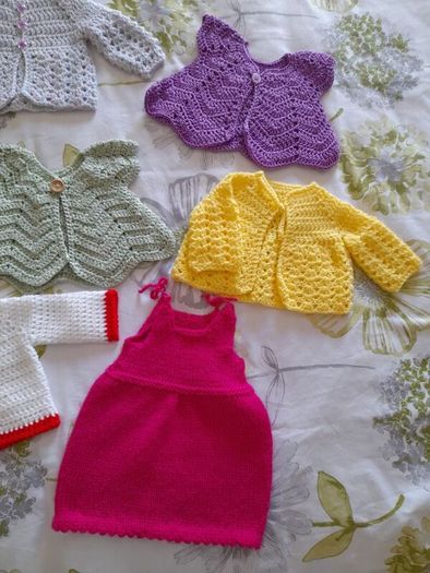Handmade baby cardigans and dresses from newborn