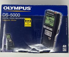 Olympus DS-5000 Digital Voice Recorder with charger unit.