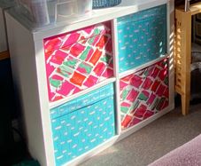 shelving unit ikea with 4 boxes