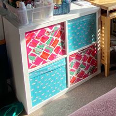 shelving unit ikea with 4 boxes