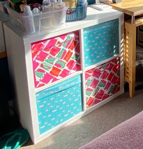 shelving unit ikea with 4 boxes