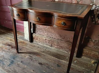 A Shereton serpentine Writing Desk