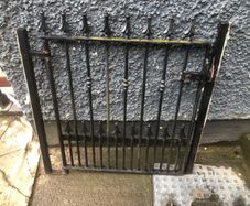 Set of wrought iron driveway gates and side gate